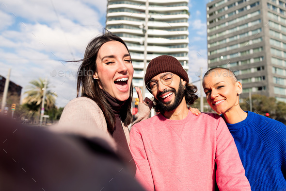 selfie of three friends having fun in the city - Stock Photo - Images