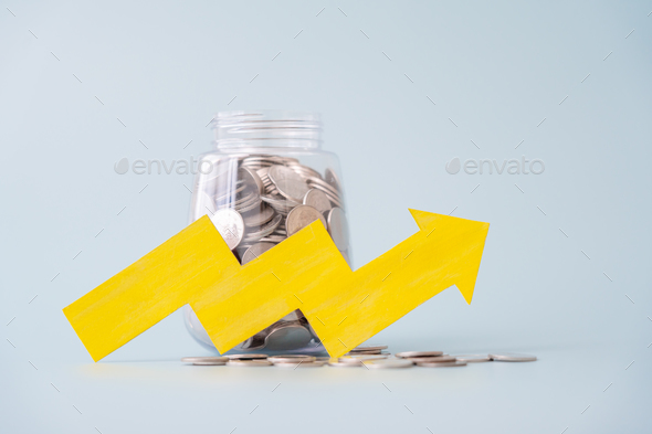 Savings money increase coins in jar and yellow paper cut arrow going up