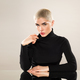 Stylish blond short hair woman posing in studio - PhotoDune Item for Sale