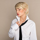 Blond woman posing in shirt and tie in studio - PhotoDune Item for Sale