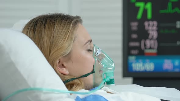 Female Patient With Oxygen Mask Lying Hospital Bed Emergency Medicine Operation Stock Footage 