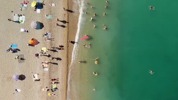 People on Sea Shore Ocean at Hot Sunny Day