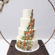 Beautiful four tiered wedding cake decorated with colorful icing flowers - PhotoDune Item for Sale