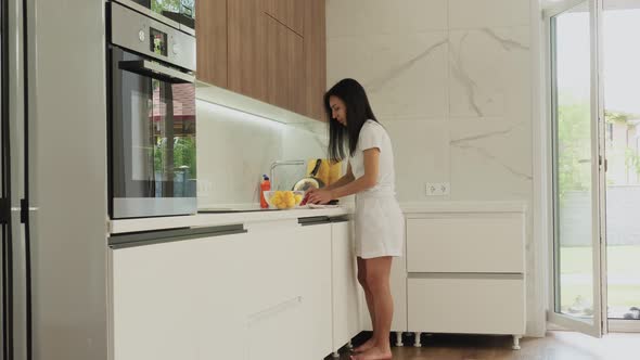 Woman Washing Fruit at Home