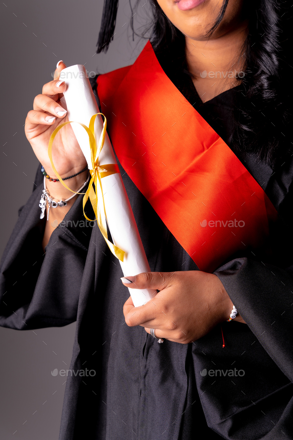 Female student in a graduation photo. End of education degree with graduate diploma