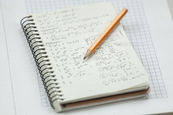Math formulas are written in pencil on a piece of paper, math pr