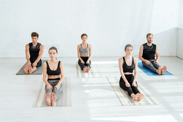 Group of People Meditation Making Sitting Yoga Pose in Luxury