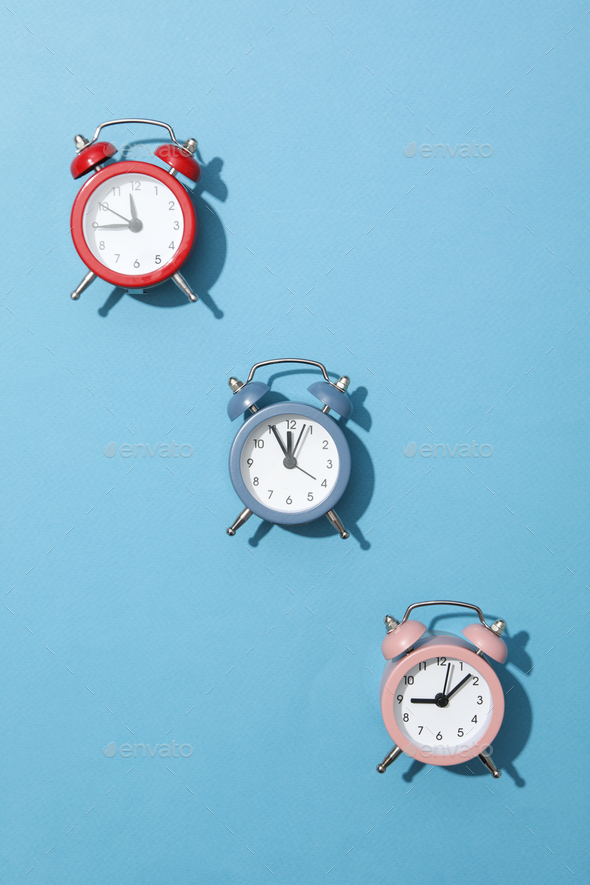 Concept of sleep and wake up with alarm clocks