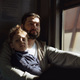 father and child sitting by the window in train. Travel concept - PhotoDune Item for Sale
