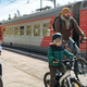 man and children on bicycles on train station travelling to countryside - PhotoDune Item for Sale
