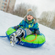 cute caucasian  boy sliding down the slope in park . Winter activities concept. Happy childhood.  - PhotoDune Item for Sale