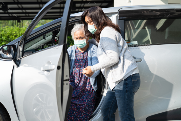 Help and support asian senior woman patient walk with walker prepare get to her car. - Stock Photo - Images