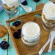 Vegan Dessert with whipped cream, nuts, oatmeal, prunes and sesame in glass glasses.  - PhotoDune Item for Sale