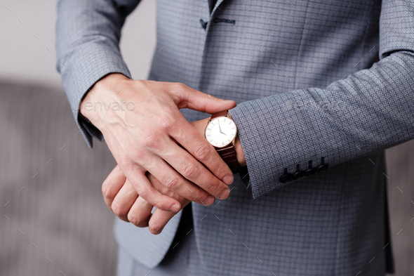 Potrait of a young businessman wearing smart watch stock photo