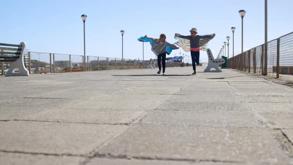 Siblings having fun near beach  alt