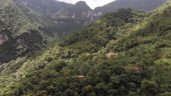 Drone shot of the Gocta falls in the Amazon of Peru from really far away flying toward the falls alt
