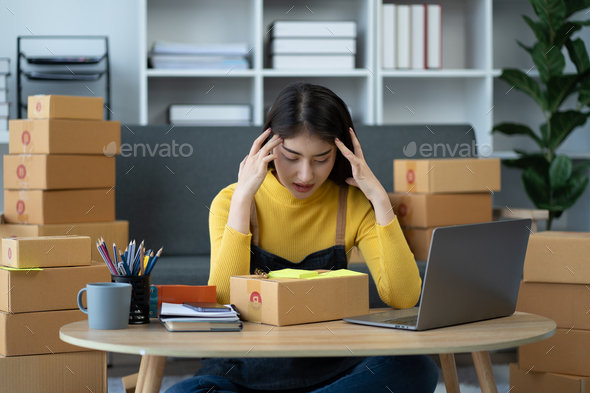 stressed woman using laptop computer and working problem to selling product online.