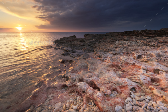 Beautiful sunset on the sea shore. - Stock Photo - Images