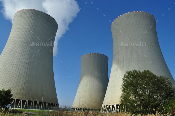 Low angle shot of Temelin nuclear power plants with blue sky above ...