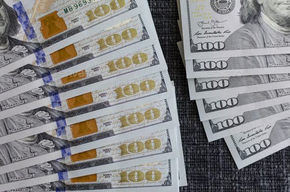 Closeup shot of some 100 dollar bills. cash. bucks. flow. money