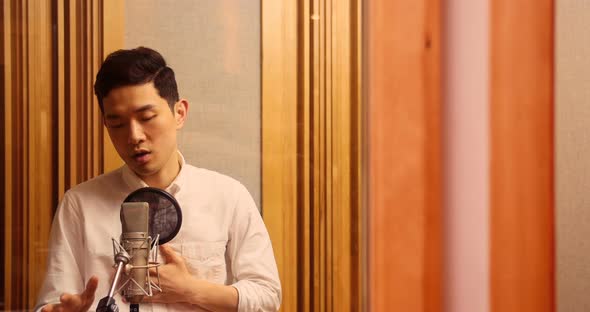 Singer performing in studio alt