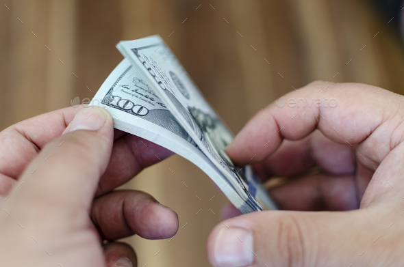Closeup shot of some 100 dollar bills. cash. bucks. flow. money