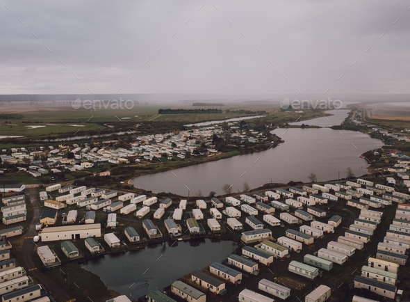 High angle shot of the rectangle houses on the fields by a beautiful ...