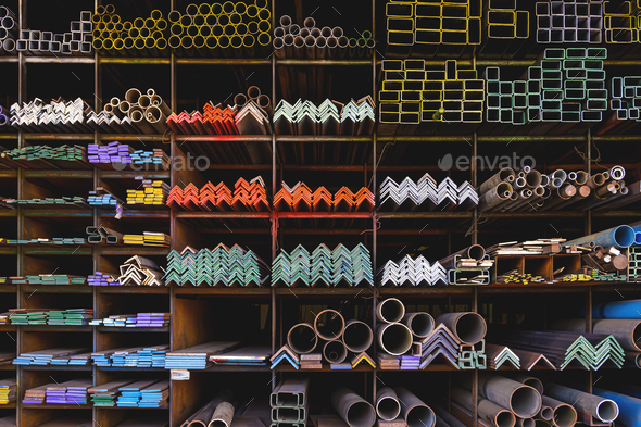 Various shape of many different steel bars and tubes on storage shelf of building supply store