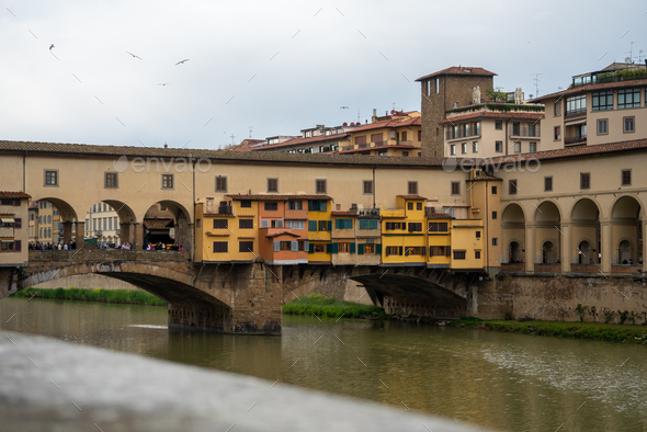 walking across the iconic Ponte Vecchio and taking in the breathtaking ...