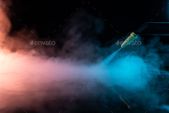 steam cleaning concept. steam on black background