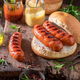 Hot grilled sausage with bun and mustard and ketchup. - PhotoDune Item for Sale
