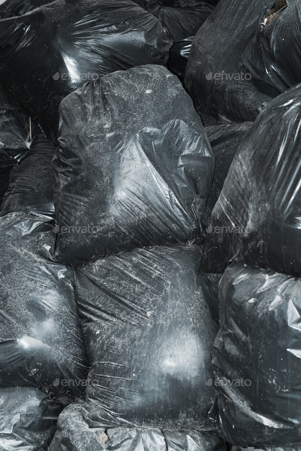 Background garbage bag black bin waste, Garbage dump, Bin,Trash, Garbage,  Rubbish, Plastic Bags pile junk garbage Trash texture, Background waste  plastic bin bag. Stock Photo