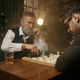 Pensive chess player moving the figure - PhotoDune Item for Sale
