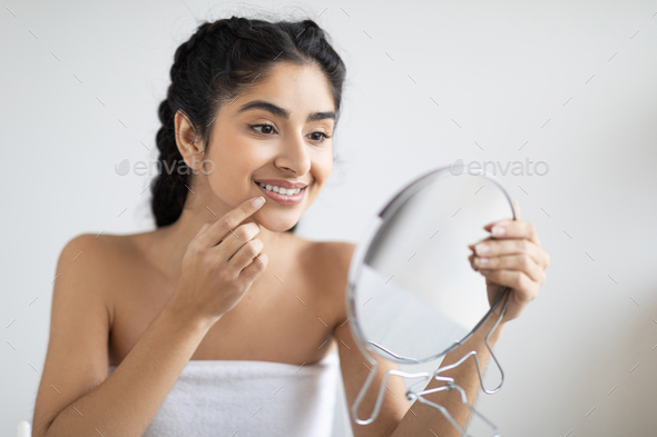 Profile of Indian woman smiling and touching her hair Stock Photo - Alamy