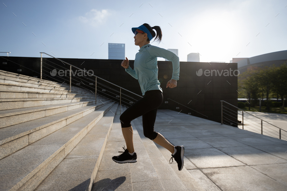Fitness sports woman running up stairs in city - Stock Photo - Images