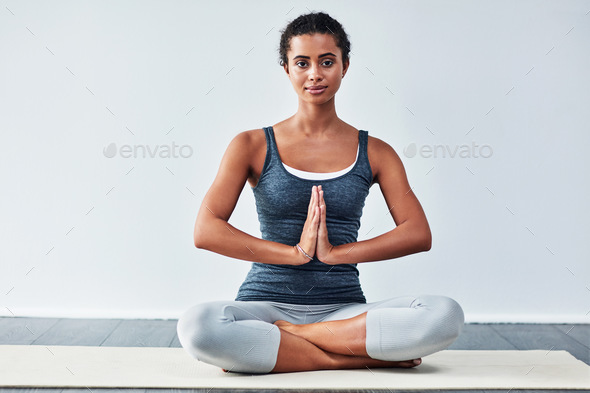 Young woman practicing yoga Stock Photo by ©gregorylee 102848320