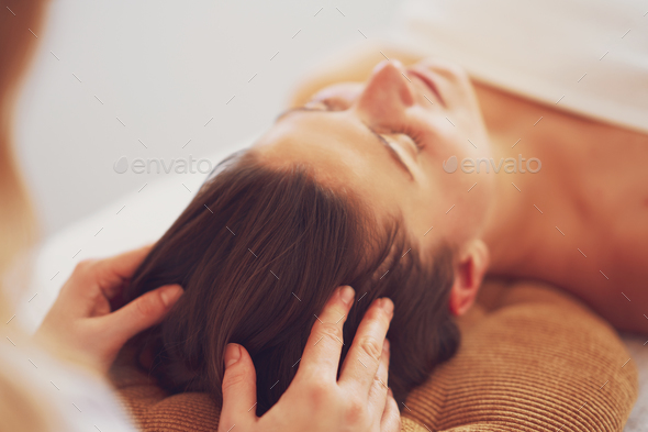Woman having japan style face massage in salon - Stock Photo - Images