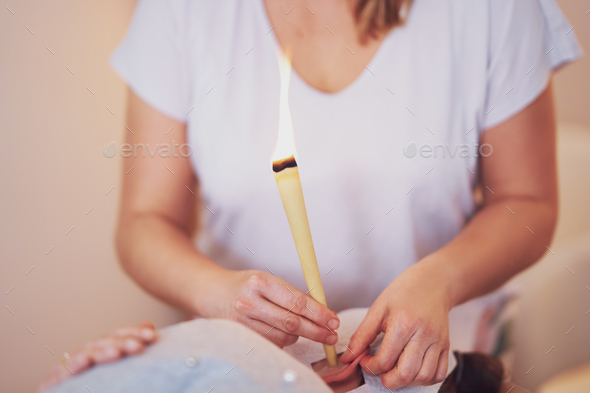 Picture of woman having candle therapy concha - Stock Photo - Images