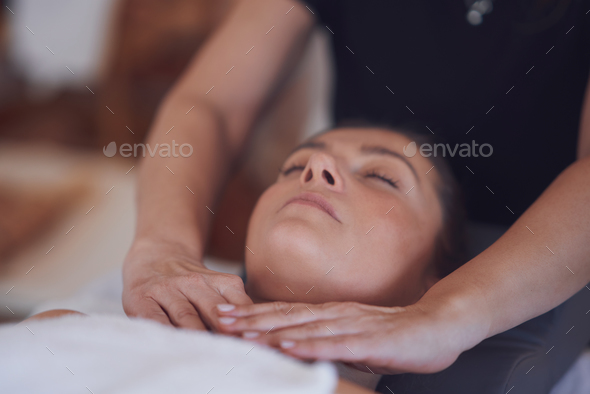 Woman having japan style face massage in salon - Stock Photo - Images