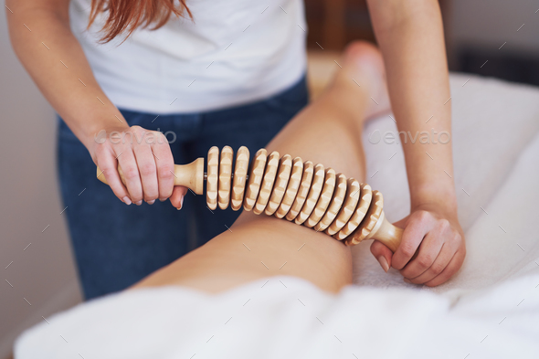 Woman at massage therapy with wooden tools - Stock Photo - Images
