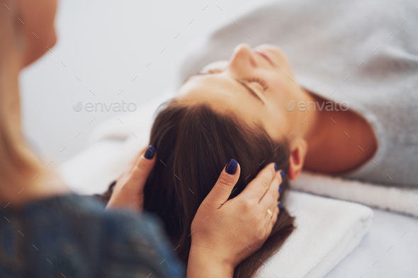 Picture of an treatment that involves gently touching 32 points on your head - Stock Photo - Images