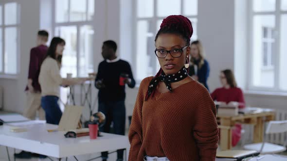 Portrait of Young African Business Woman in Eyeglasses Posing Serious and Stressed, Then Smiling at