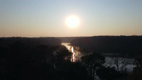 1 million $ aerial view flight slowly rising down drone footage of a sunset and no clouds in the woo alt