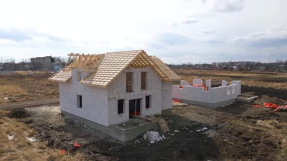 Aerial View of Unfinished Frame of Private House with Aerated Lightweight Concrete Walls and Wooden alt