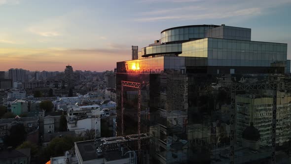 Reflection of the sun in the business center building