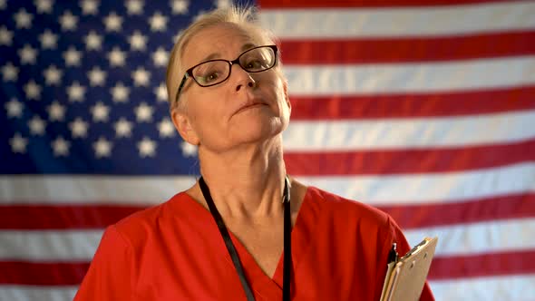 Medium tight portrait of a healthcare nurse with clipboard looking happy and relieved walking toward alt