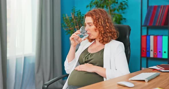 Elegant Women Tired After Working at a Desk in Front of a Computer Monitor Rests alt