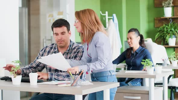 Focused Young Businessman Working Hard with His Middle Age Manager alt