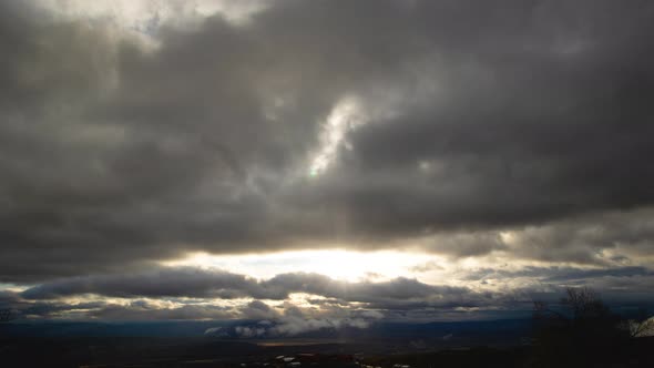 Storm Clouds and Bright Sun Wide Shot Time Lapse