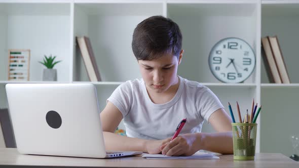 Pre Teen Handsome Boy Pupil Attending to Home Online School Class on His Computer Laptop Because of alt